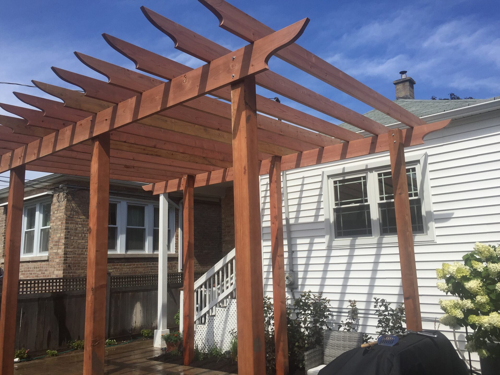 Completed cedar pergola over backyard patio